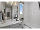 Bright bathroom with a tub and shower combination, white tile, and sleek fixtures at 1793 W 166Th Ave, Broomfield, CO 80023