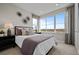 Bright bedroom with large window offering field view, stylish wall decor, and neutral tones at 1793 W 166Th Ave, Broomfield, CO 80023