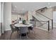 Stylish dining area with hardwood floors and staircase access next to the kitchen at 1793 W 166Th Ave, Broomfield, CO 80023