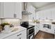 Modern kitchen features white cabinets, an oven, and white countertops at 1793 W 166Th Ave, Broomfield, CO 80023