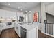 Bright, modern kitchen features an island with a stainless steel dishwasher at 1793 W 166Th Ave, Broomfield, CO 80023