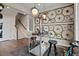 Modern living space with hardwood flooring, and a unique bicycle wheel wall decoration at 1793 W 166Th Ave, Broomfield, CO 80023