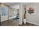 Modern living space with hardwood flooring, and a unique bicycle wheel wall decoration at 1793 W 166Th Ave, Broomfield, CO 80023