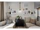 Inviting living room with neutral walls, plush couches, decorative shelving, and ambient lighting at 1793 W 166Th Ave, Broomfield, CO 80023