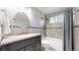 Bathroom with shower-tub combo, tile backsplash, and granite vanity top at 13399 Wyandot St, Westminster, CO 80234