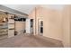 Bedroom with vaulted ceilings, open closet and view to the ensuite bathroom at 16901 E Chenango Ave # E, Aurora, CO 80015