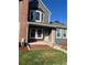 Inviting townhome with manicured lawn and brick accents, offering a warm welcome under clear skies at 16901 E Chenango Ave # E, Aurora, CO 80015