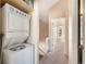 Hallway with a laundry area and view of the stairs at 16901 E Chenango Ave # E, Aurora, CO 80015