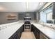 Modern kitchen with stainless steel appliances, stylish backsplash, and ample counter space at 16901 E Chenango Ave # E, Aurora, CO 80015