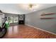 Bright living room showcasing wood floors, fireplace, modern lighting, and large window at 16901 E Chenango Ave # E, Aurora, CO 80015
