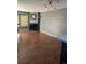 Spacious living room with hardwood floors, cozy fireplace, and ample natural light at 16901 E Chenango Ave # E, Aurora, CO 80015
