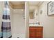 Full bathroom with walk-in shower featuring a stylish curtain and a single sink at 641 Briar Haven Dr, Castle Pines, CO 80108