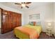Cozy bedroom with a ceiling fan, a decorative headboard, and double-door closet at 641 Briar Haven Dr, Castle Pines, CO 80108