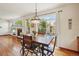 Cozy dining area next to a sliding glass door providing access to the outdoor patio at 641 Briar Haven Dr, Castle Pines, CO 80108