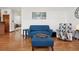 Inviting living room space with hardwood floors and a comfortable blue sofa at 641 Briar Haven Dr, Castle Pines, CO 80108