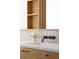 Modern bathroom featuring a white quartz countertop and wood cabinetry with black hardware at 2060 Hoyt St, Lakewood, CO 80215