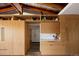 Custom kitchen featuring light wood cabinetry, open shelving, and a light countertop at 2060 Hoyt St, Lakewood, CO 80215