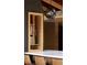 Interior detail of kitchen built-ins, open shelving, and black brick accent wall at 2060 Hoyt St, Lakewood, CO 80215