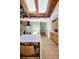 Modern kitchen with a long island, skylights, natural wood cabinets and gas range at 2060 Hoyt St, Lakewood, CO 80215