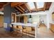 Bright open kitchen with an island, wood beams, skylights and modern appliances at 2060 Hoyt St, Lakewood, CO 80215