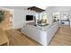 Spacious living room with large sectional sofa, wood floors, and modern decor at 2060 Hoyt St, Lakewood, CO 80215
