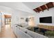 Bright living room with wood floors, beamed ceiling, and modern decor at 2060 Hoyt St, Lakewood, CO 80215