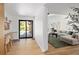 Bright open concept living and work space with hardwood floors and neutral tones at 2060 Hoyt St, Lakewood, CO 80215
