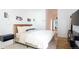 Bright bedroom with a comfortable bed, modern lighting, and streamlined decor at 2060 Hoyt St, Lakewood, CO 80215