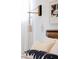 Close up of a bedroom featuring modern wall lighting and stylish decor at 2060 Hoyt St, Lakewood, CO 80215