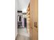 Organized walk-in closet with wooden storage system and black hardware at 2060 Hoyt St, Lakewood, CO 80215