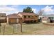 Backyard view of the home with a spacious deck, fenced yard, and shed at 11338 Donley Dr, Parker, CO 80138