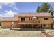 Backyard view of the home with a large deck, offering ample outdoor living space at 11338 Donley Dr, Parker, CO 80138