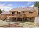 Backyard view of the home with a large deck, offering ample outdoor living space at 11338 Donley Dr, Parker, CO 80138