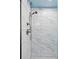 Modern bathroom featuring a shower with elegant marble tile and sleek fixtures at 11338 Donley Dr, Parker, CO 80138