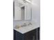 Bathroom vanity featuring a marble countertop, modern faucet, and ample storage space below at 11338 Donley Dr, Parker, CO 80138