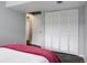Bedroom featuring new flooring, a large closet, and doorway to hall at 11338 Donley Dr, Parker, CO 80138