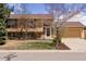 Charming two-story home with a well-manicured front yard and a welcoming entrance at 11338 Donley Dr, Parker, CO 80138