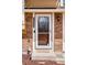 Charming front door with brick facade and visible house number at 11338 Donley Dr, Parker, CO 80138