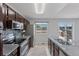 Well-lit kitchen featuring stainless steel appliances, granite countertops, and access to a deck at 11338 Donley Dr, Parker, CO 80138