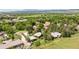 An aerial view of a home showcasing the roof and lush surroundings at 7475 W Vassar Ave, Lakewood, CO 80227