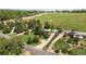 A high-angle view of a home and neighborhood surrounded by lush greenery at 7475 W Vassar Ave, Lakewood, CO 80227
