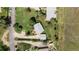 An aerial view of a home showcasing the roof, yard, and surrounding trees at 7475 W Vassar Ave, Lakewood, CO 80227