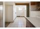 Basement laundry room with a small window at 7475 W Vassar Ave, Lakewood, CO 80227