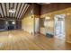 Bright living room with wood floors, brick fireplace and access to kitchen at 7475 W Vassar Ave, Lakewood, CO 80227
