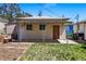 Backyard featuring a covered patio area connecting outbuildings, a well maintained lawn and garden beds at 8881 Lilly Dr, Thornton, CO 80229