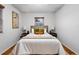 Relaxing bedroom featuring a queen bed, hardwood floors, and bedside tables with lamps at 8881 Lilly Dr, Thornton, CO 80229