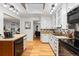 Well-lit kitchen featuring light colored countertops, and hardwood flooring at 8881 Lilly Dr, Thornton, CO 80229