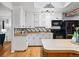 Modern kitchen featuring white cabinets, butcher block countertops, and stainless steel appliances at 8881 Lilly Dr, Thornton, CO 80229