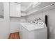 Convenient laundry room features modern appliances and ample storage space at 8881 Lilly Dr, Thornton, CO 80229