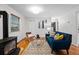 Cozy living room features a modern fireplace, hardwood floors, and stylish furniture at 8881 Lilly Dr, Thornton, CO 80229
